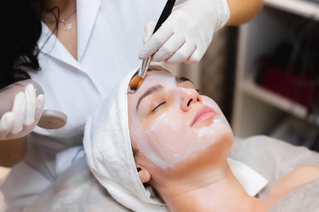 Aesthetician applying Circadia hydrating facial mask at Aesthetic Studio in St. Augustine, Florida