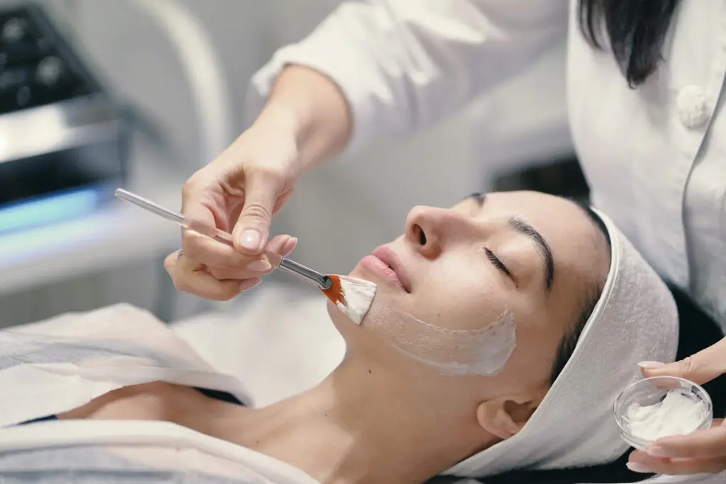 Young woman receiving chemical peel facial at Aesthetic Studio in St. Augustine, Florida