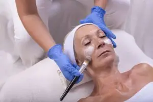 Woman receiving customized chemical peel facial at Aesthetic Studio in St. Augustine, Florida